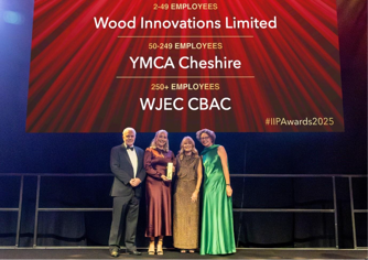 A group of people standing in front of a sign

AI-generated content may be incorrect.