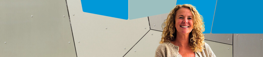 Headshot of Rep header Emma Vincent in front of a modern geometric wall